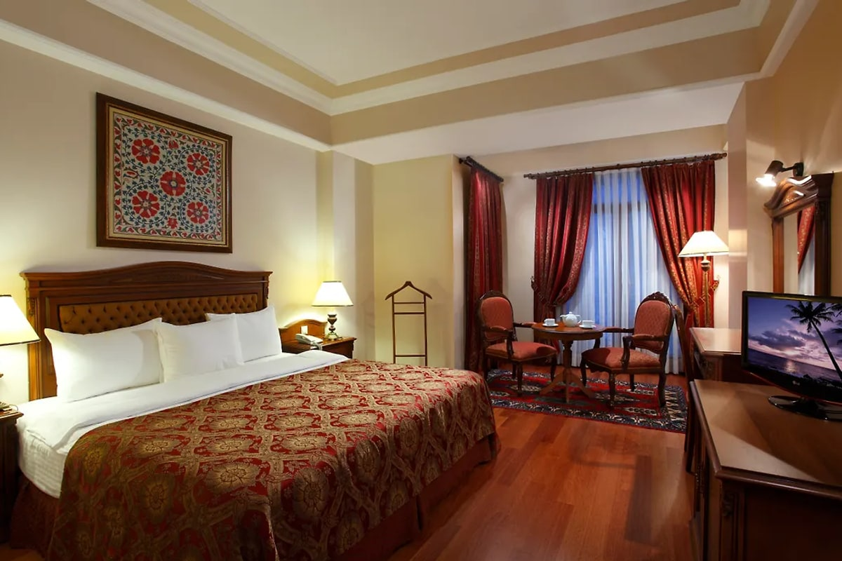 Interior detail with antique furniture and brass.