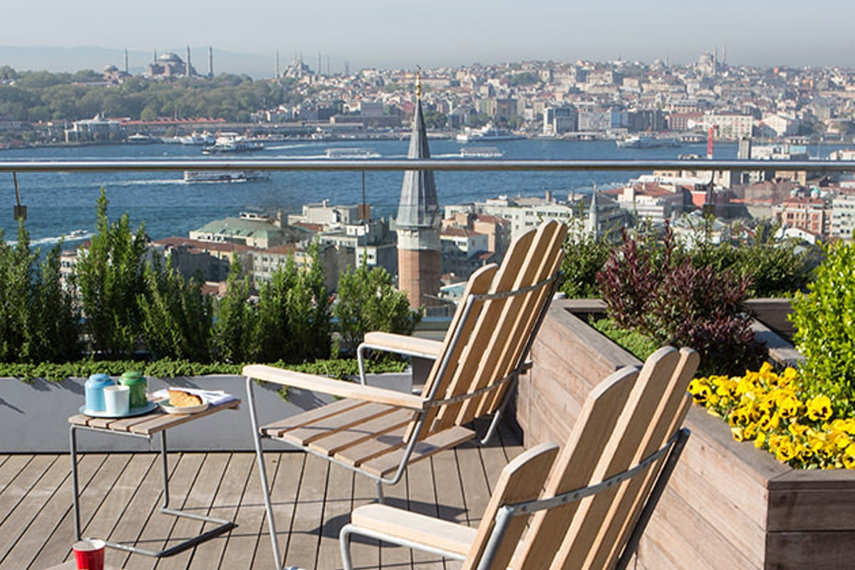 Permaculture rooftop garden with edible herbs and Bosphorus view